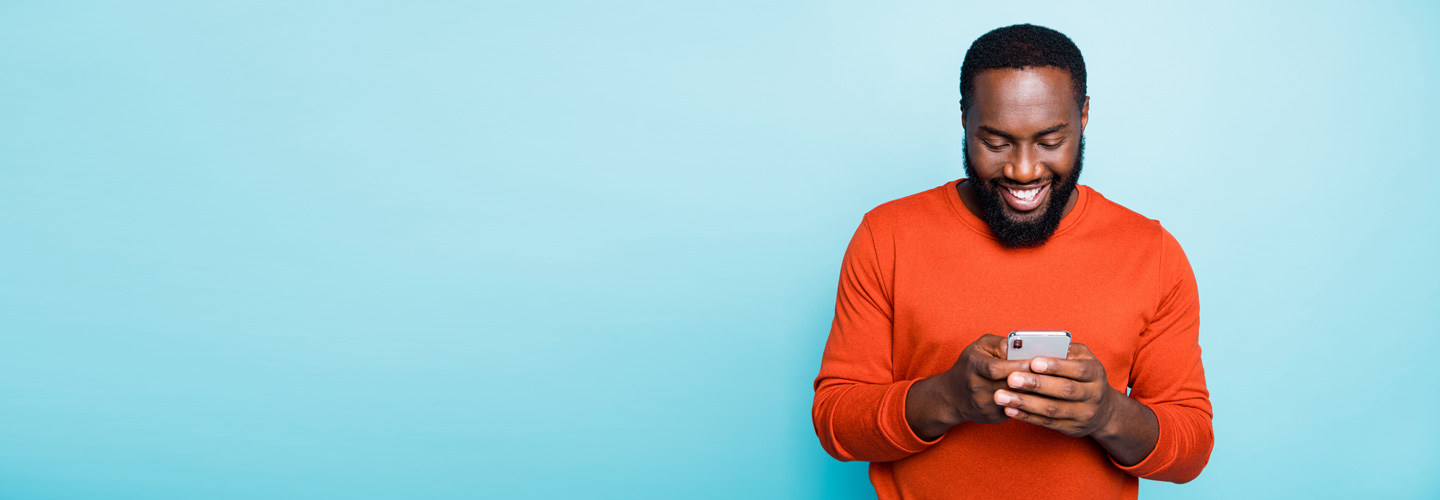image of man texting on phone
